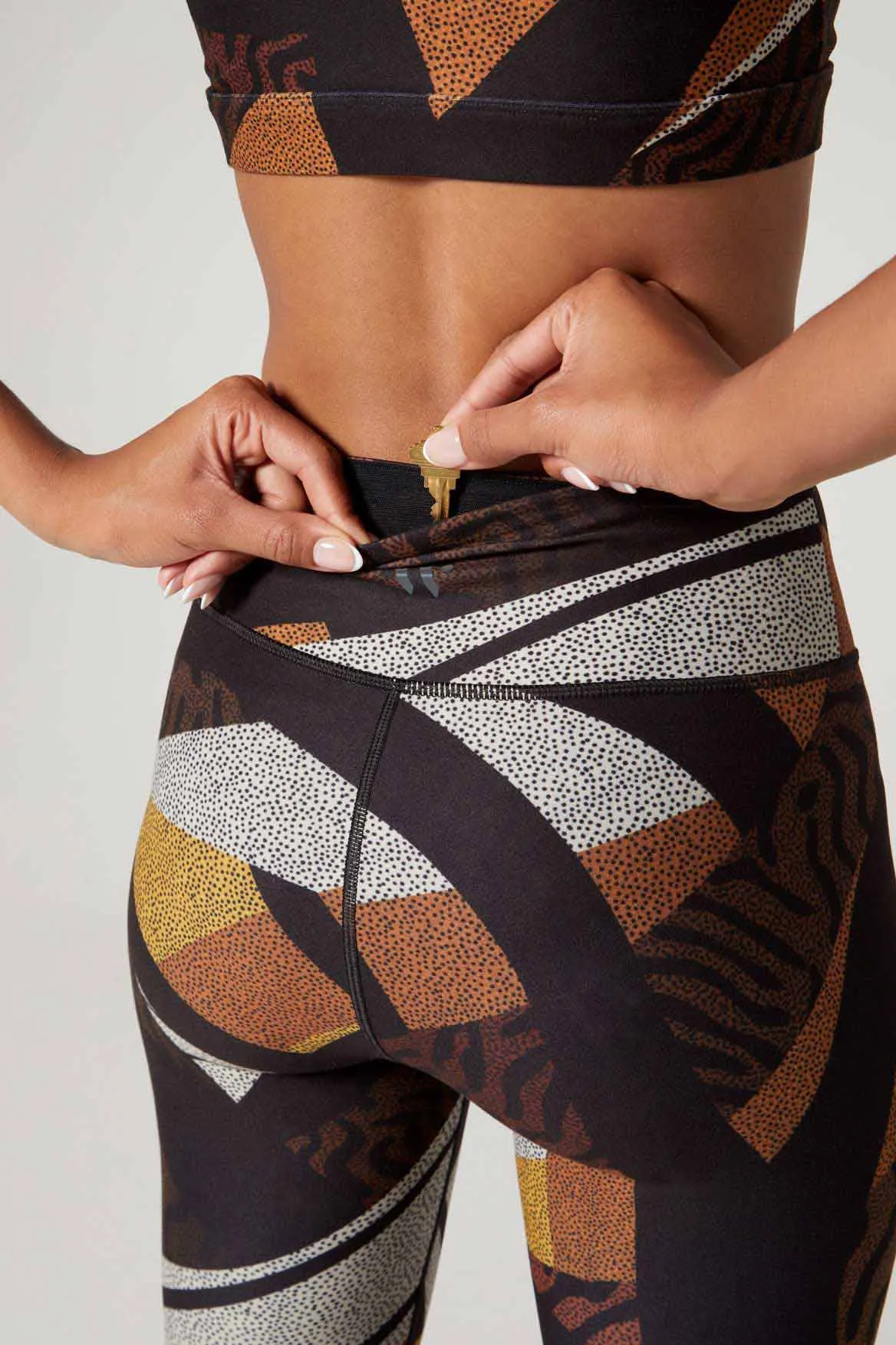 Sure! Heres an optimized title for the product with additional descriptive modifiers:

Aria High-Waisted Back Pocket Leggings - Totem Pattern, Moisture-Wicking, and Four-Way Stretch Fabric
